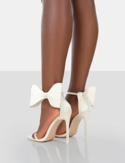 Public Desire Zeal Wide Fit Off Satin Strappy Bow Ankle Detail Stiletto Heels | Women Barely There Heels
