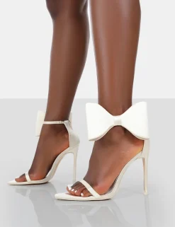 Public Desire Zeal Wide Fit Off Satin Strappy Bow Ankle Detail Stiletto Heels | Women Barely There Heels